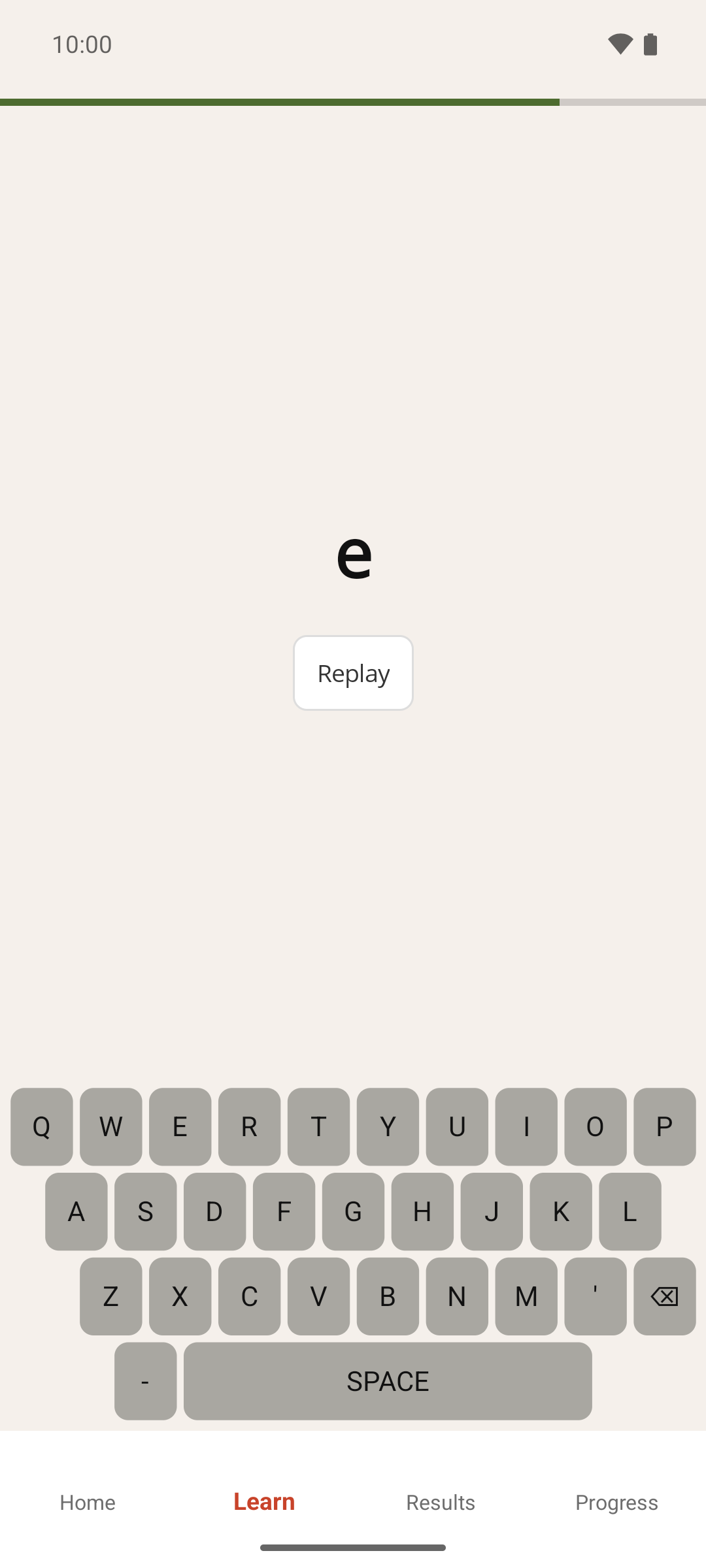 The Learn screen part-way through a word, with the timer bar partly used, the letters typed so far and the Replay button